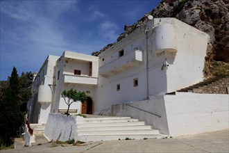 White monastery in the mountains near the coastal road to Agios Nikolaos