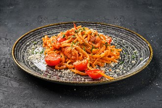 Plate with pasta with tomato and parmesan cheese