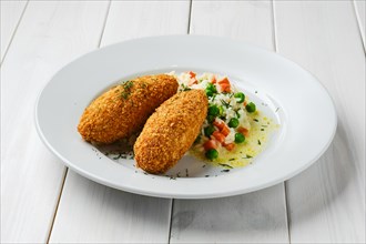 Cutlet stuffed with cheese served with rice