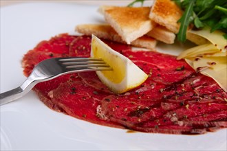 Closeup view of beef carpaccio with cheese