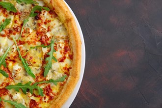 Top view of four cheeses delicious pizza with thick crust