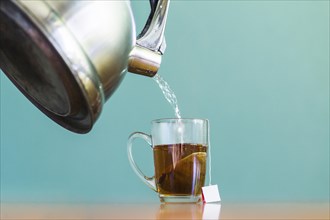 Water pouring into glass cup tea. Resolution and high quality beautiful photo