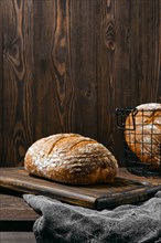 Artisan whole grain wheat bread on wooden table