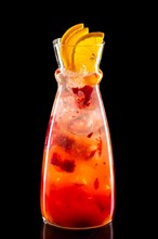 Pitcher with raspberry and orange ice lemonade isolated on black background