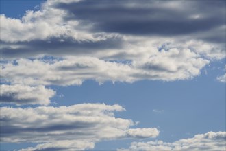 Abstract fluffy white clouds float in the blue sky background. Zambia