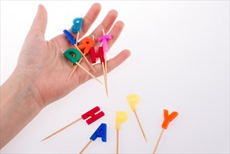 Colored envelopes and Color candles on sticks write happy