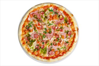 Top view of pizza with ham and sausage decorated with bell pepper and parsley