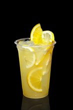 Cold Lemon cocktail with a sparkling wine with ice cubes in take away glass isolated on black