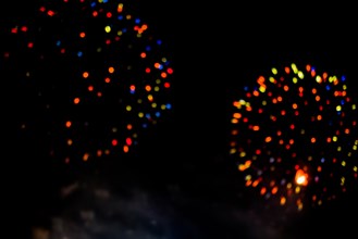 Festive colour firework background at a dark night
