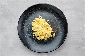 Top view of classic scrambled eggs on a plate