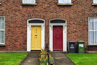 Typical terraced houses with small front garden and colourful doors