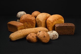 Assortment of artisan bread made of different types of grain with different shapes