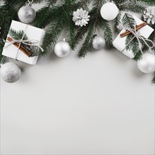 Christmas composition fir tree branches with silver baubles