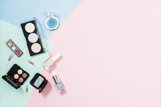 Overhead view cosmetic products pastel background