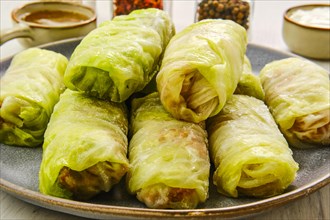 Close up view of rolled cabbage leaves stuffed with ground meat