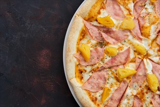 Close up view of pizza with chicken ham and pineapple