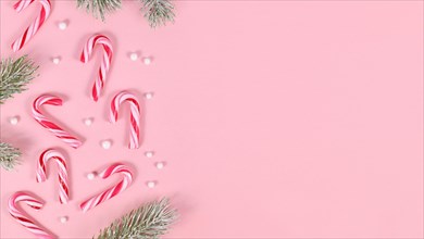 Banner with striped Christmas candy cane sweets