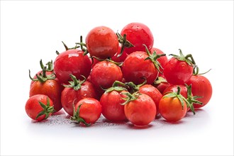 Fresh wet tomato cherry isolated on white background