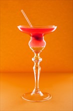 Scofflaw cocktail on orange background