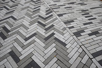 Creative structure with paving stones on sidewalk