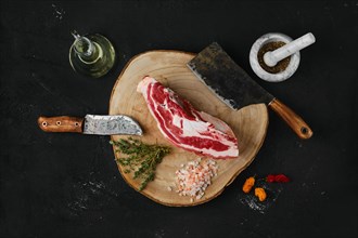 Raw beef brisket on wooden cutting board