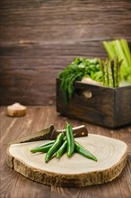 Fresh green cilli pepper on wooden cutting board
