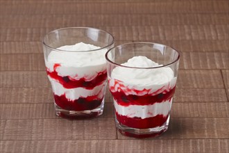Strawberry layered dessert with creamy yogurt in glass