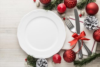 Flat lay christmas tableware with empty plate