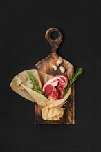 Raw fresh lamb double loin chop wrapped in paper