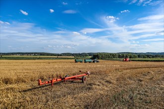 Agricultural machinery during the harvest in the field