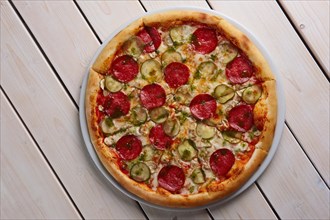 Top view of whole pizza with sausage
