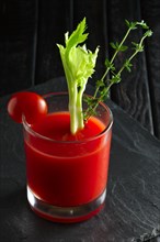 Cocktail Bloody Mary on dark wooden background