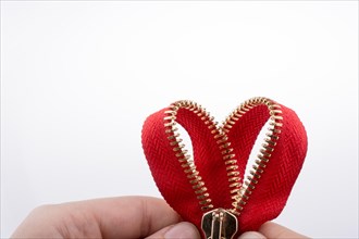 Heart shaped zipper on a white background
