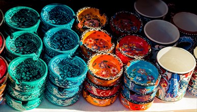 Set of colored ceramic ashtrays in view