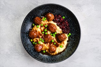 Top view of meatballs with gravy served with mashed potato
