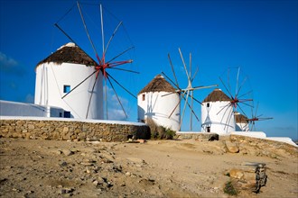 Scenic view of famous Mykonos town windmills. Traditional greek windmills on Mykonos island