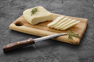 Homemade country style goat cheese on cutting board
