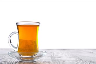 Low angle photo of cup with hot tea with copy space on white background