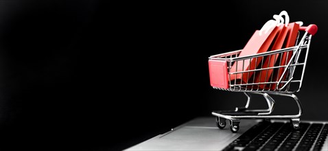Front view cyber monday shopping cart with bags copy space