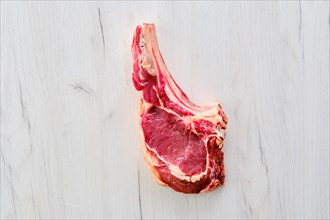 Overhead view of beef ribeye steak bone-in
