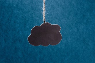 Black cloud on a blue background