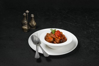 Lamb stew with tomato on a plate