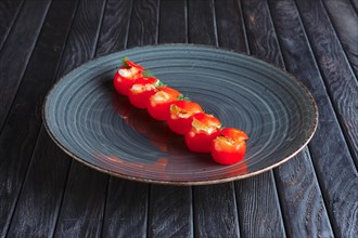 Appetizer for reception. Tomato cherry stuffed with mozzarella end egg