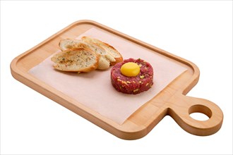 Classic steak tartare with egg and garlic bread