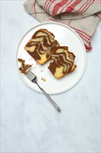 Two pieces of marble cake on plate