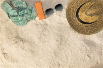 Hat sunglasses blue sandals sunscreen sand