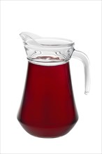 Big pitcher with plum juice isolated on white background