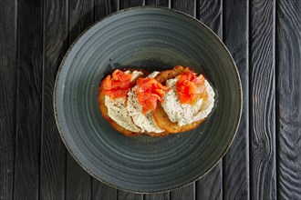 Top view of potato pancakes with salmon and mozarella