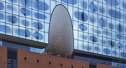 Part of the facade with visitors on the public viewing platform of the Elbe Philharmonic Hall
