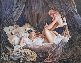 Woman with dog in bed